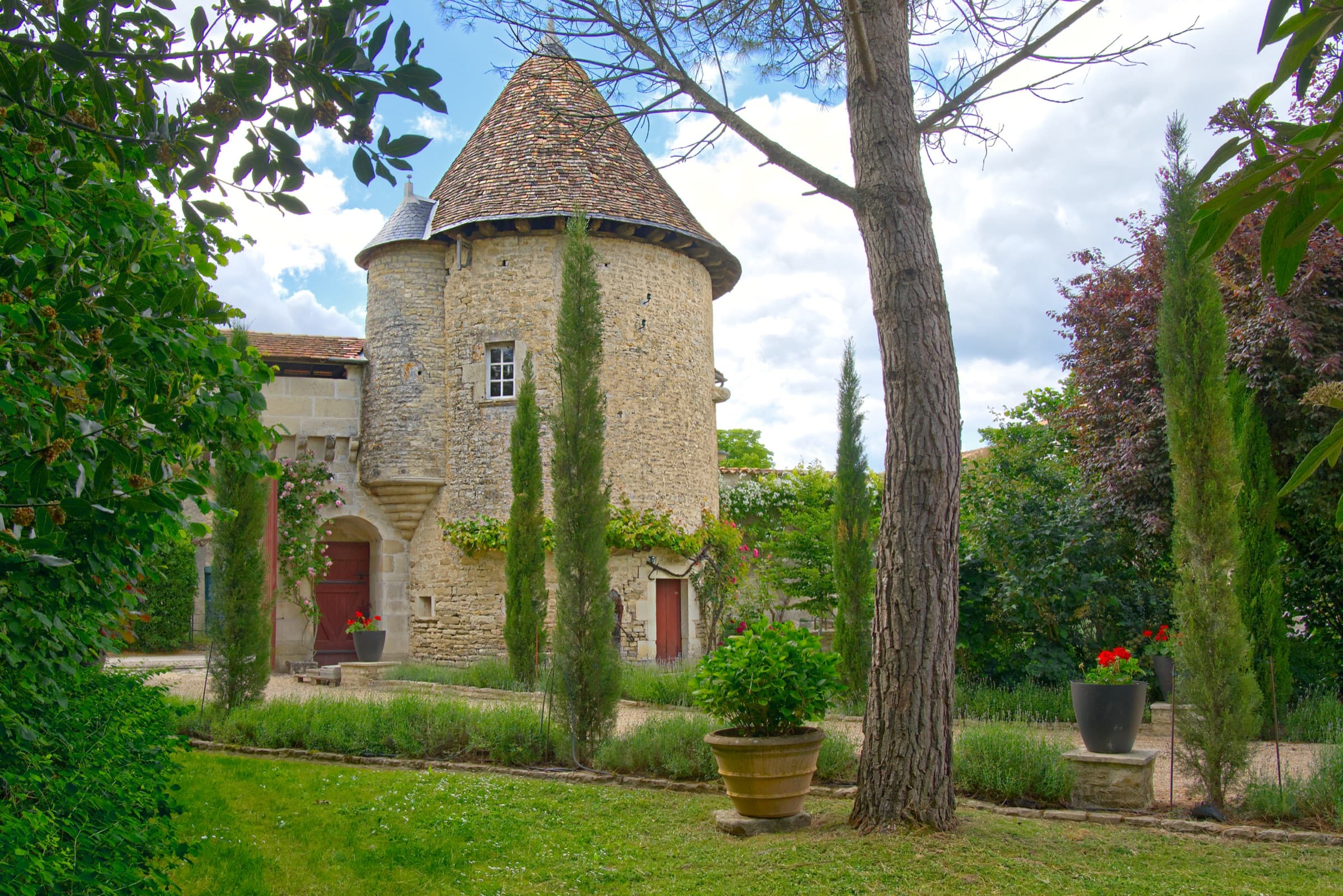 The 15th-century round turret at Château Lesvescault — venue for the wine and cheese experience