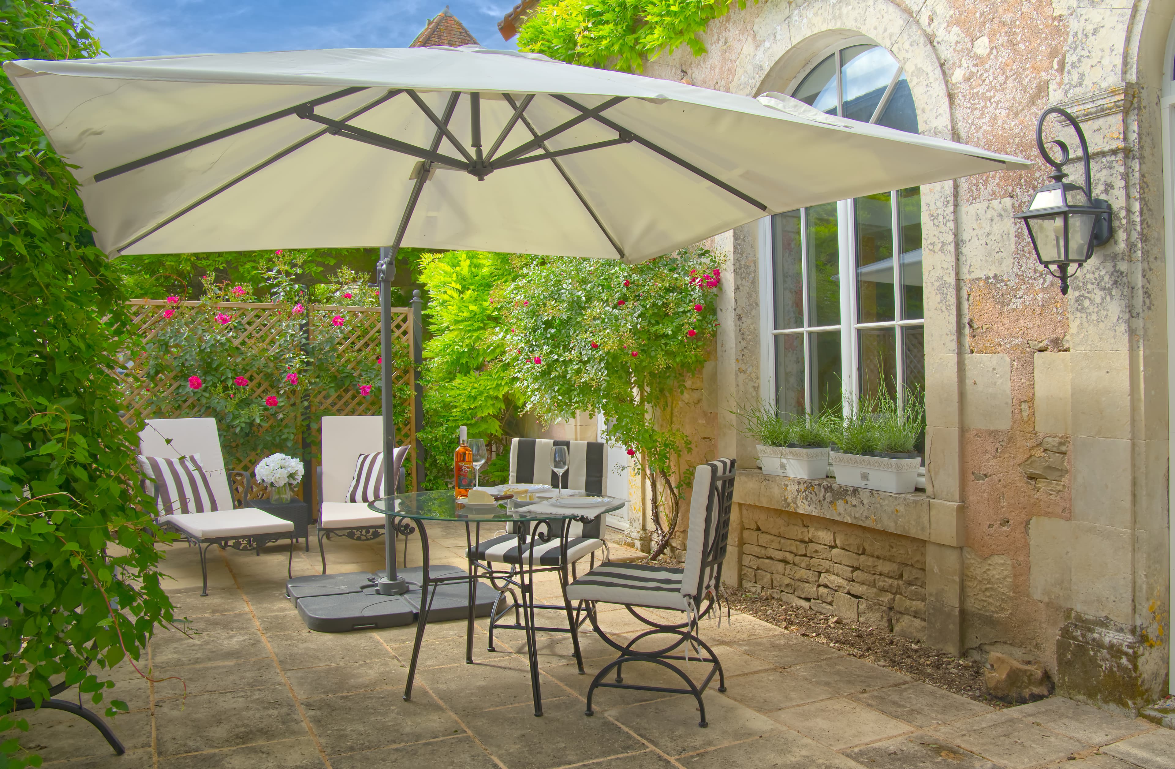 L'orangerie interior with oak beams and linen
