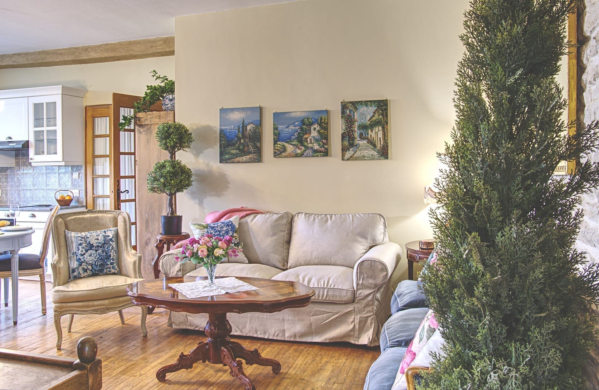 Maison Juliette — salon with stone walls and linen armchairs