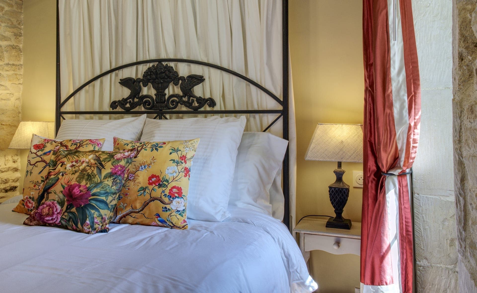 Maison Olivier — wrought iron four-poster bed
